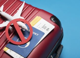 red luggage with passport xed out international business travel