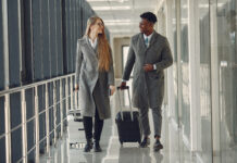 Business Travel Optimism on the Rebound Couple at the airport.