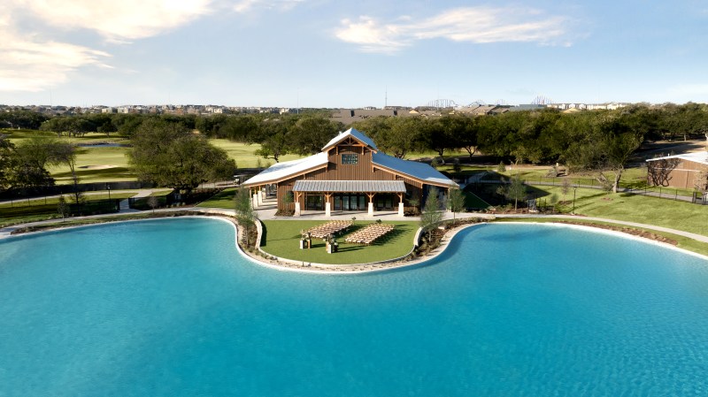 The new Rancher Hall event venue fronts The Big Spring Lagoon.