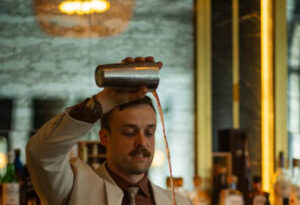 Exclusive: The Medicine Cabinet Behind the Bar Gavin Miller pouring a cocktail